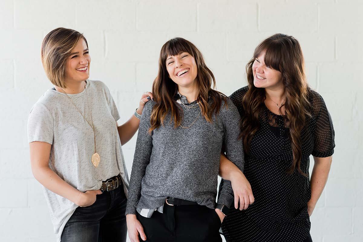 three women laughing